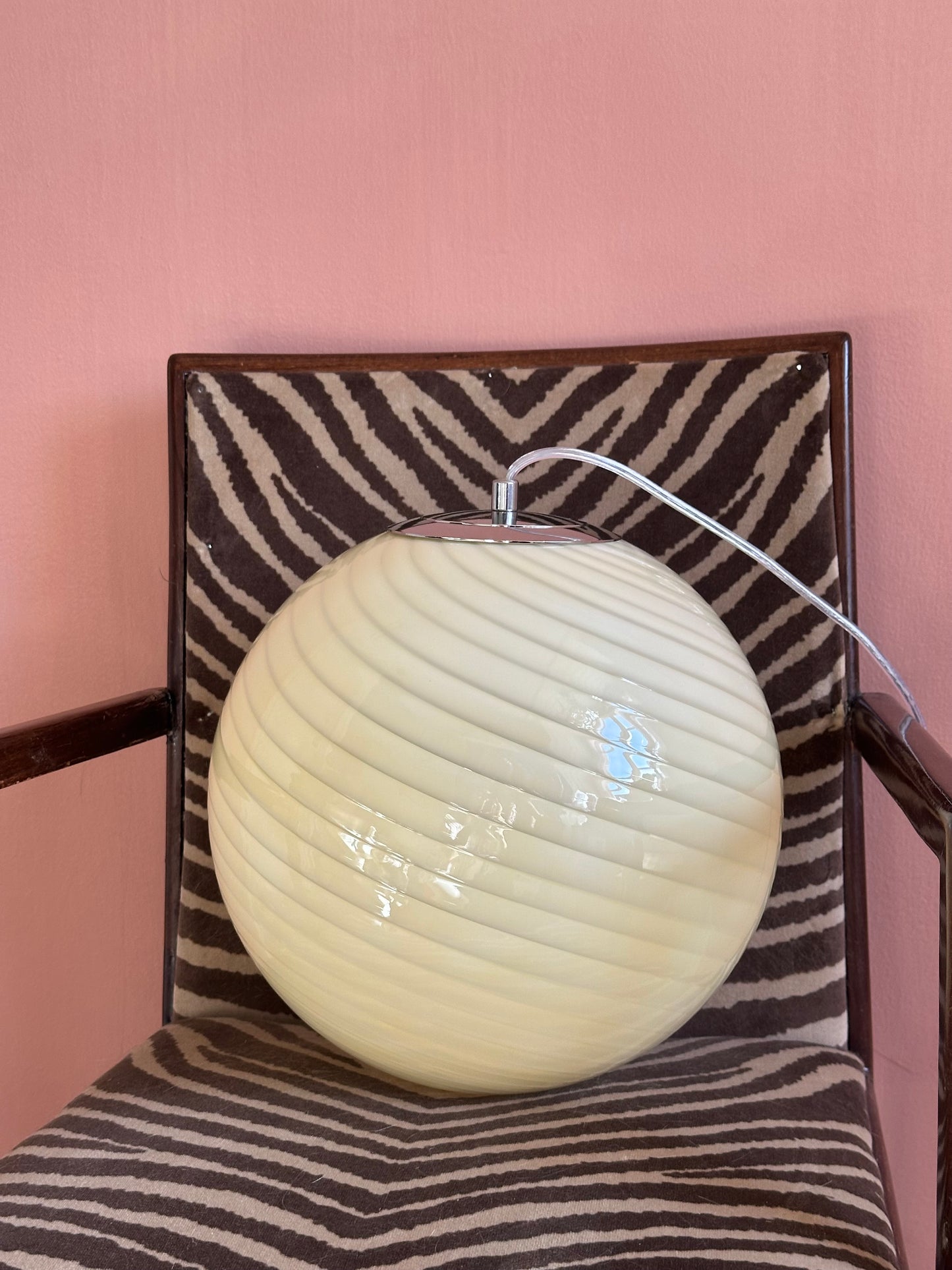 Murano style beige swirl glass globe pendant light with spiral glass pattern, round detail view